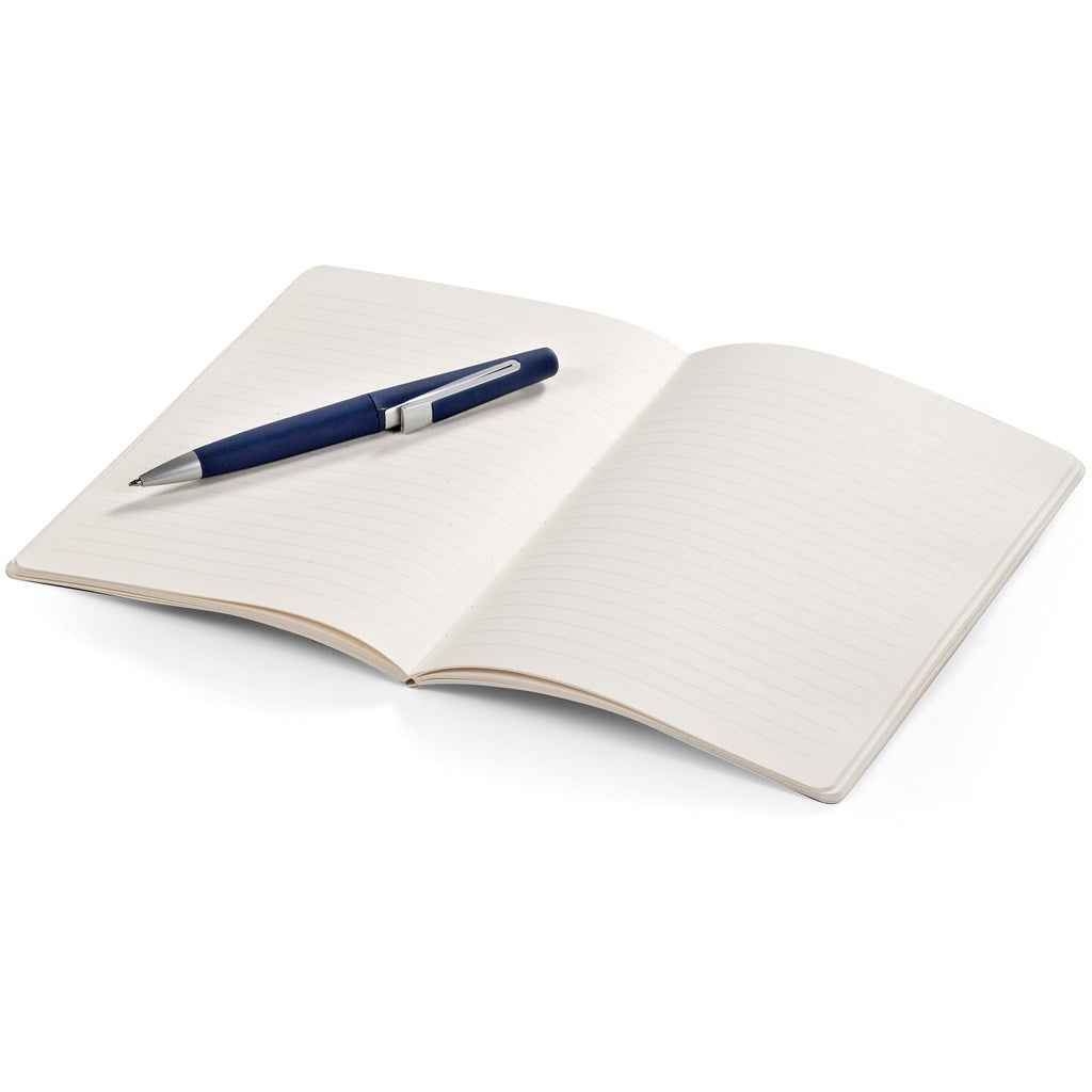 Open notebook with a pen sitting on the open book