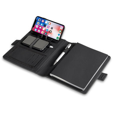 Black organizer with phone stand, pen holder, and notebook on a white background