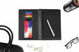 Wireless power bank and notebook shown with other corporate branded goods
